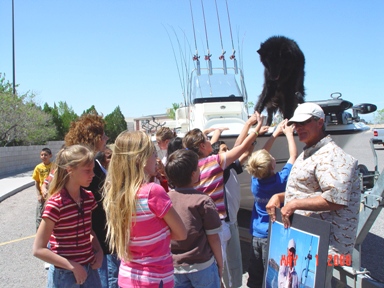 MoonDoggo, the Fishing Dog, is always happy to Shake Hands with Children!