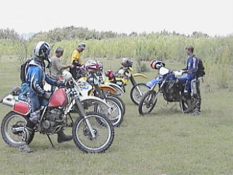 Motorcycle Riders take a Break from the Trail for a Fish Fry by the Rio Grande River, with their Bikes all in a Row