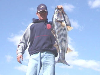 Guide, Billy Jack Miller, Jr. with a 30lb striper